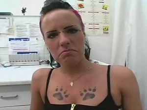 A chick with tattoos and piercings masterbates in a doctors office.