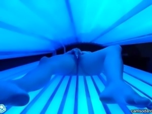 teen latina college student gives lesbian pussy a massage in tanning bed