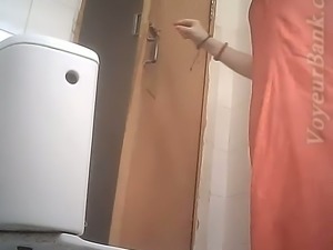 Pale skin sexy lady in pink dress gets her ass filmed on spycam