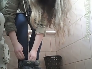 Lovely white blonde girl in blue jeans pisses on hidden cam