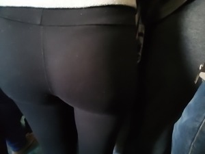 Round and tight ass in black leggings