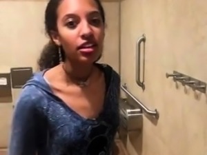 Stunning ebony girl peels off her clothes in a public toilet