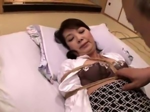 Restrained Japanese granny braces herself for a deep fucking