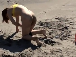 Two striking Asian girls nailed hard together on the beach