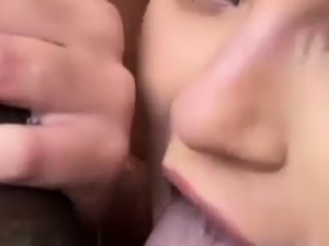 Amateur baclk mother giving a blowjob to a big black cock